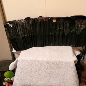 Set of 24 makeup brushes with roll up case, tie closure.